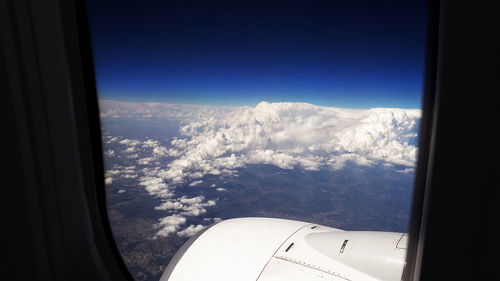 Scenic view of mountains seen through airplane window