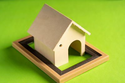 High angle view of toys against green background