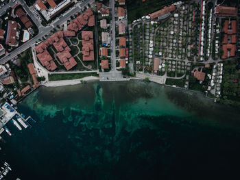 High angle view of buildings by sea