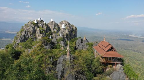 Panoramic view of trees and buildings against sky