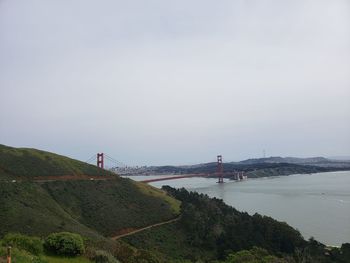 View of suspension bridge over sea