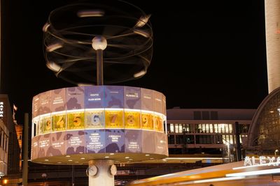 Low angle view of illuminated lights at night