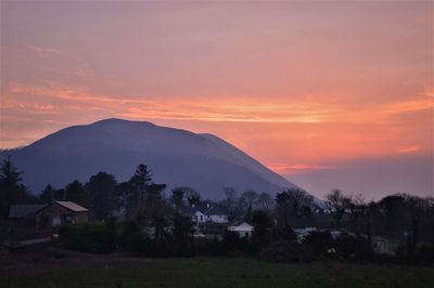 Scenic view of mountains against sky during sunset