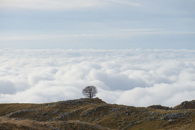 Mountain and cloudscape against sky