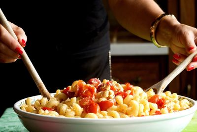 Midsection of woman preparing food on table