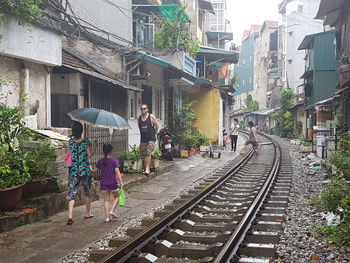 People walking on railroad track