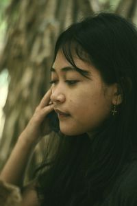 Close-up of young woman looking away