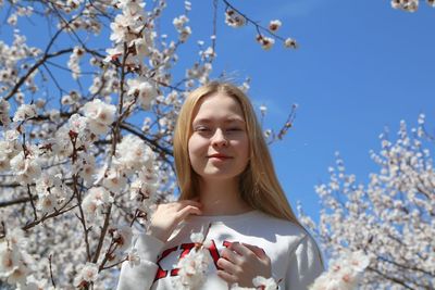 Low angle view of woman against sky