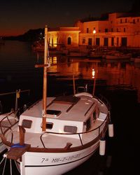 Boats in water at night