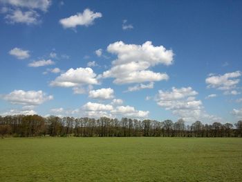 Scenic view of landscape against cloudy sky