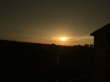 Silhouette of built structures at sunset