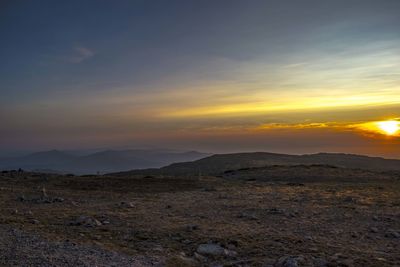 Scenic view of landscape against sky during sunset