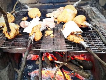 High angle view of meat on barbecue grill