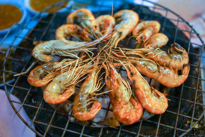 High angle view of meat on barbecue