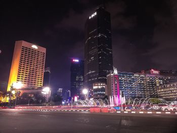 Illuminated buildings in city at night