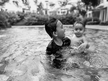 Portrait of happy boy in swimming pool