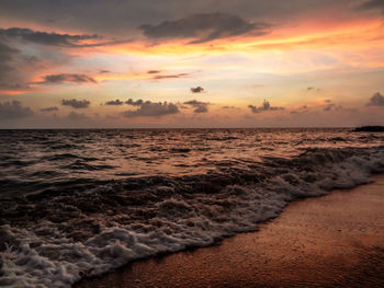 Scenic view of sea against dramatic sky