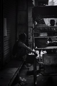 Rear view of man working at construction site