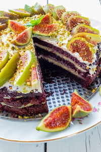 Close-up of cake and fruit in plate