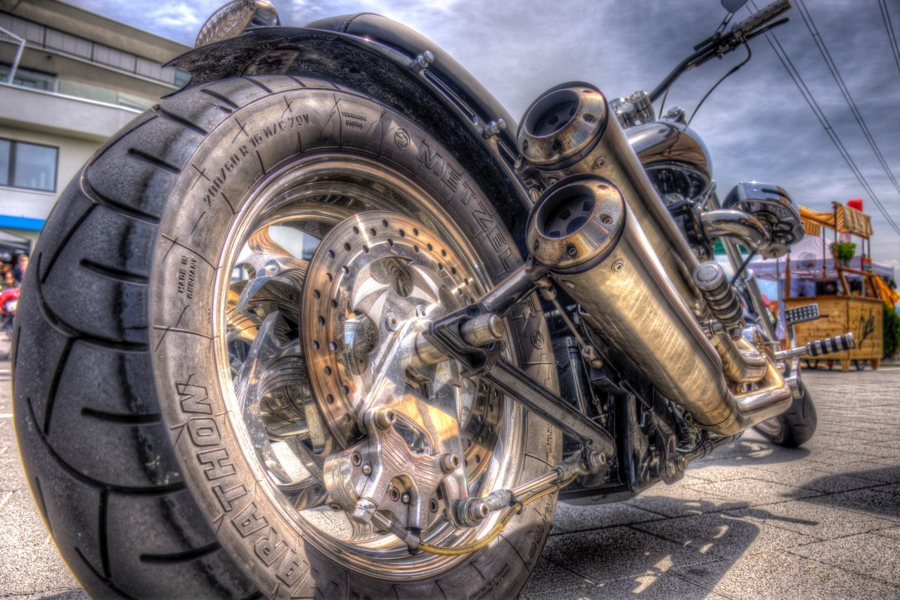 CLOSE-UP OF VINTAGE CAR ON ROAD