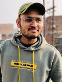 Portrait of young man standing outdoors