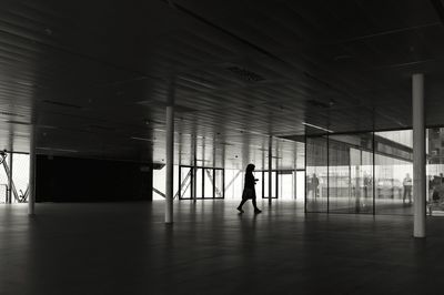 Woman walking in tunnel