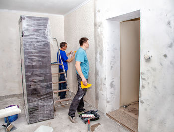 Male workers renovating home