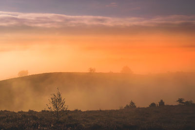 Scenic view of landscape against sky during sunset