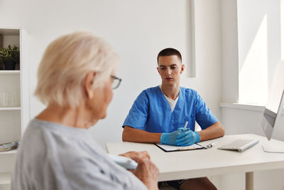 Female doctor working at office