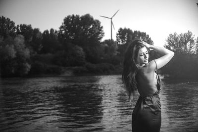 Portrait of woman standing in water