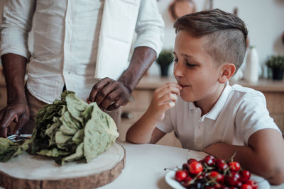 Rear view of people having food