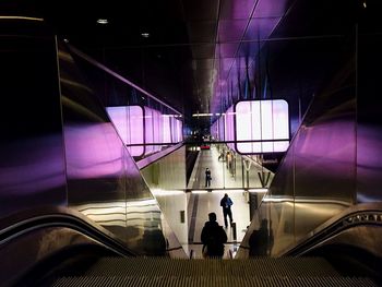 Woman looking at escalator