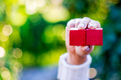 Close-up of boy holding toy heart