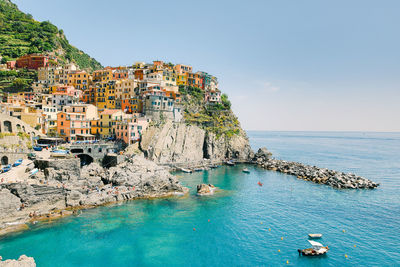 Scenic view of sea and rocks against sky