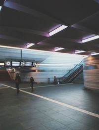 View of woman in dark room
