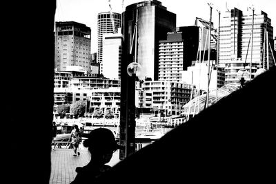 Silhouette buildings against sky in city