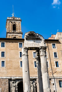 Low angle view of historical building against blue sky