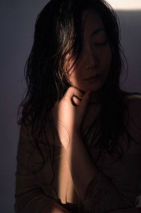 Portrait of young woman with wet hair 