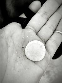 Close-up of hand holding ice