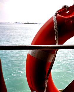 Close-up of rope in sea against sky