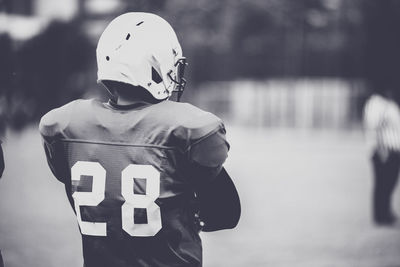 Rear view of american football player