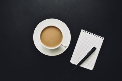 High angle view of coffee on table against black background