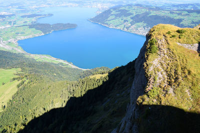 High angle view of rock formations by sea