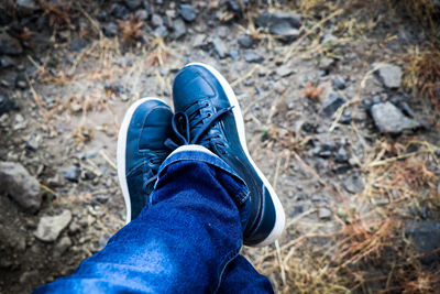 Low section of man wearing shoes