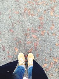 Low section of man standing on ground