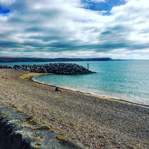 Scenic view of beach against sky