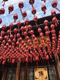 Low angle view of lanterns hanging on building