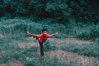 Full length of man standing on field