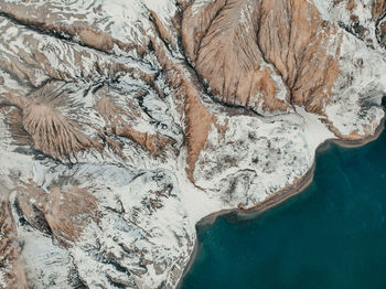 High angle view of frozen sea shore