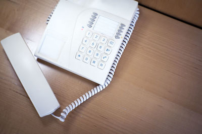 High angle view of mobile phone on table